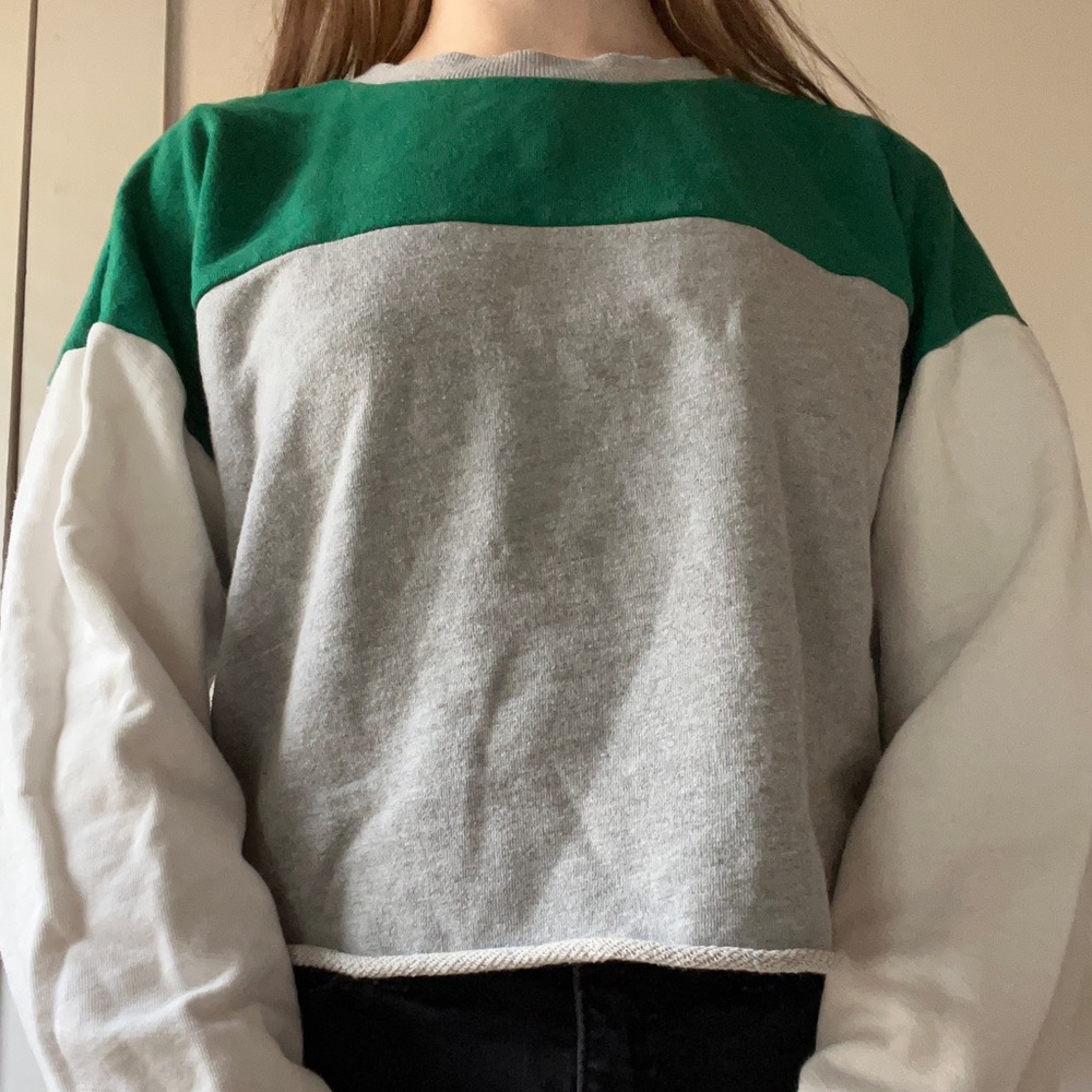 Grey, green, and white sweater.